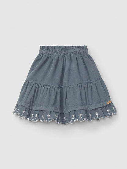 Falda de pana con volante de flores bordadas Laranjinha, azul petróleo