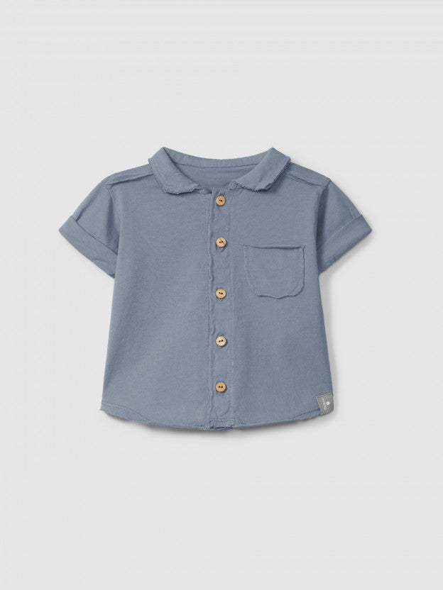 Polo de punto liso con bolsillo Snug, índigo