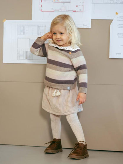 Falda de terciopleo acanalado detalle de cordón con pompón