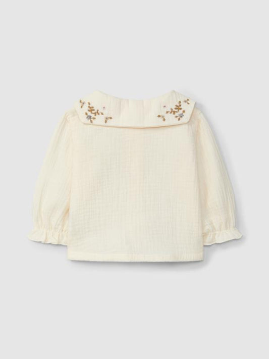 Blusa de muselina con cuello de flores bordadas
